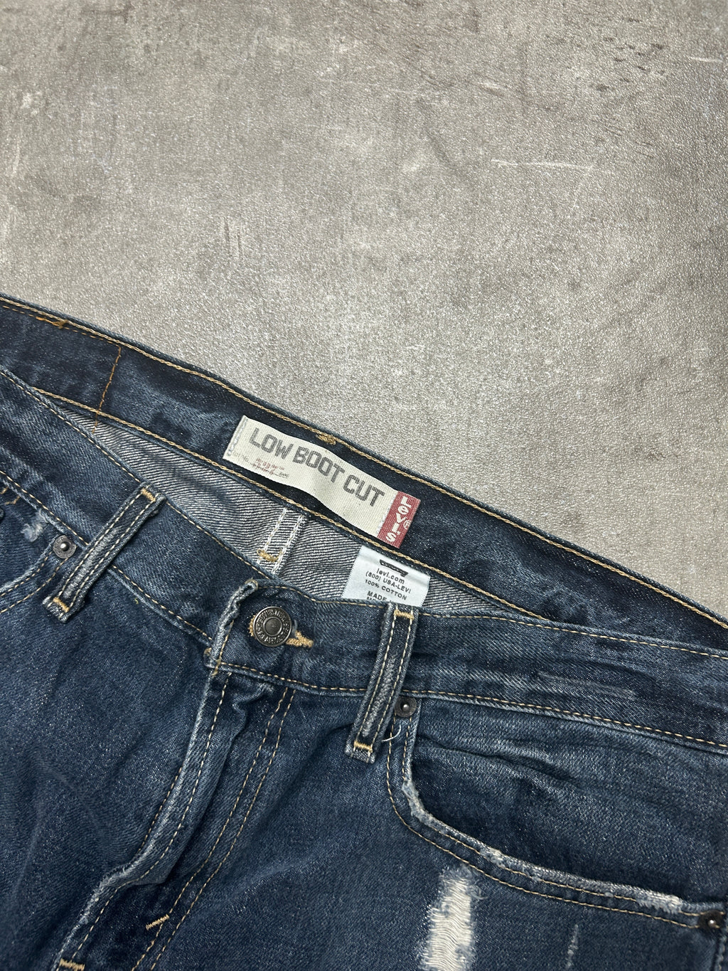 distressed Levis 527 Low Bootcut (W33 L33, M-L)