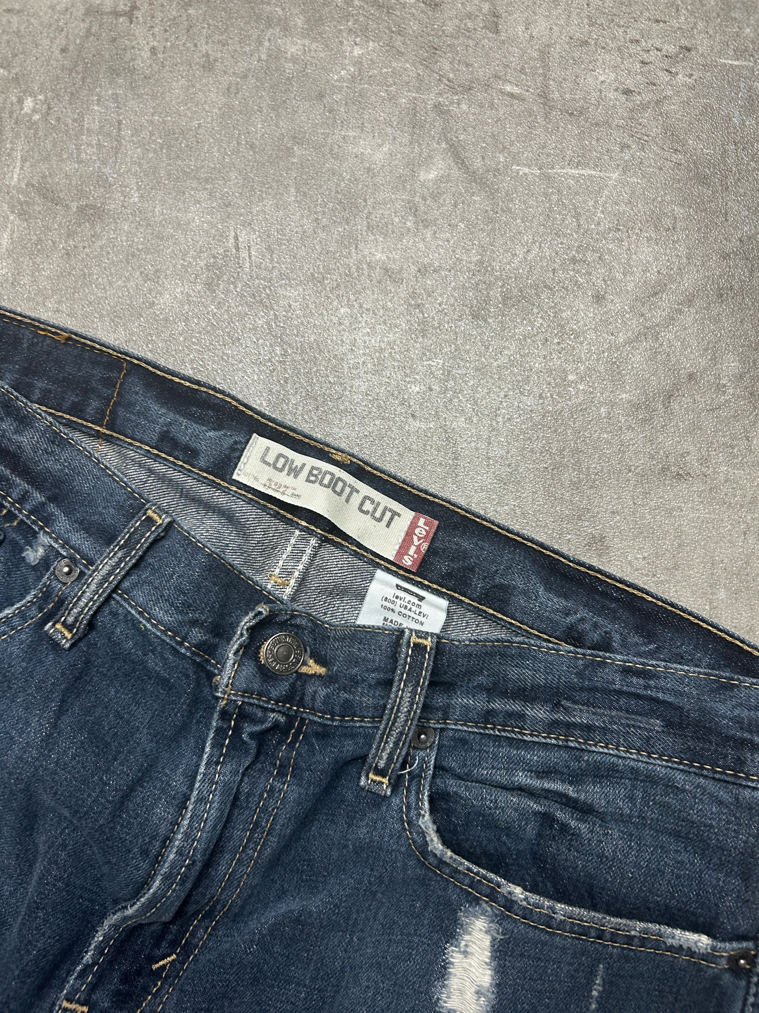distressed Levis 527 Low Bootcut (W33 L33, M-L)